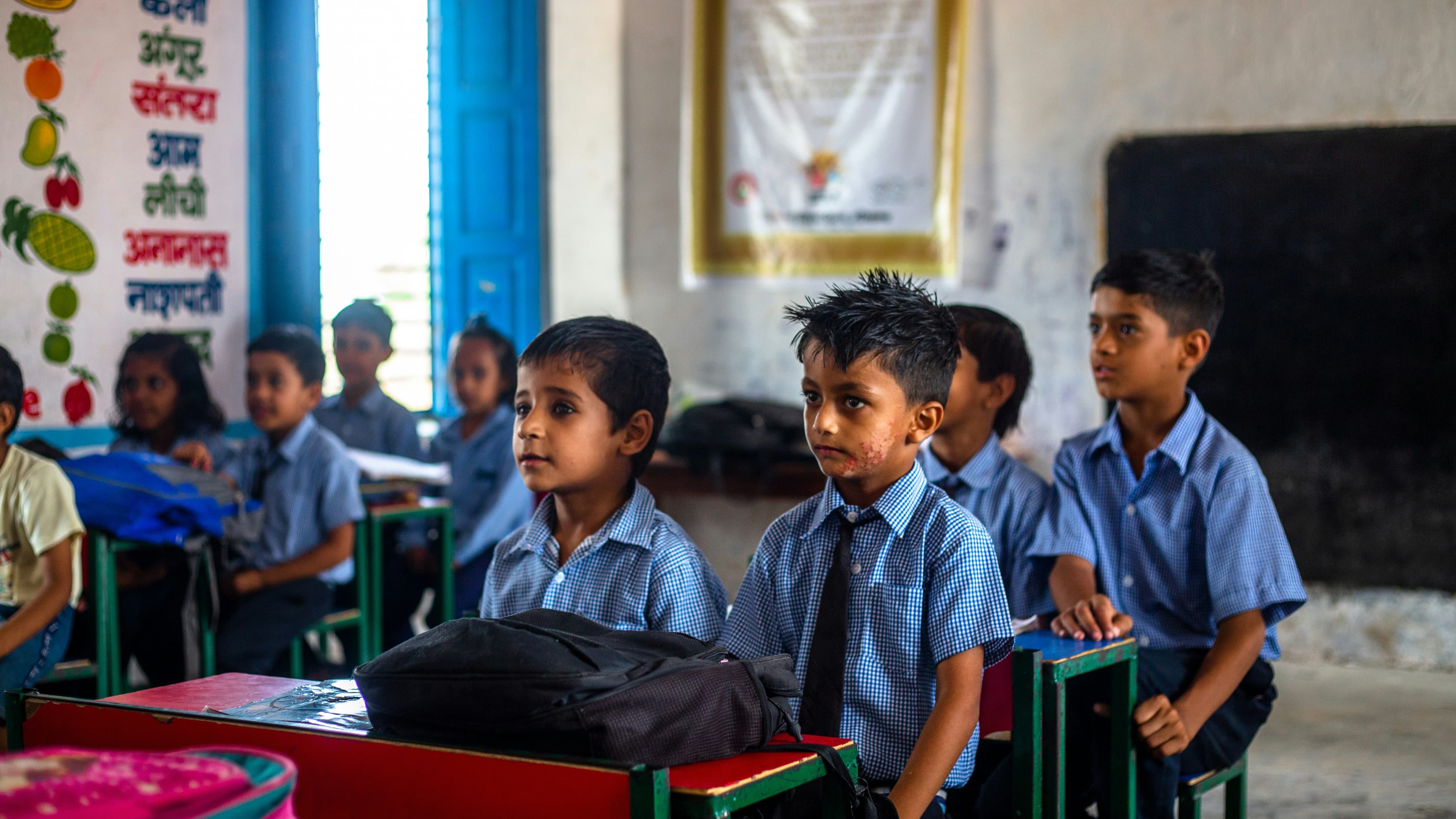 Rural Indian teacher educating students in classroom